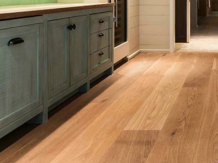 Wide plank wood flooring in a rustic kitchen