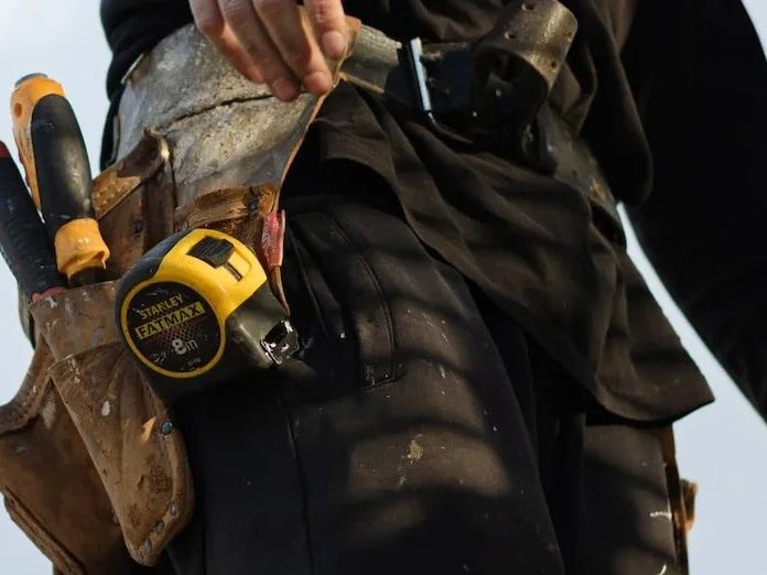 Flooring contractor with tool belt